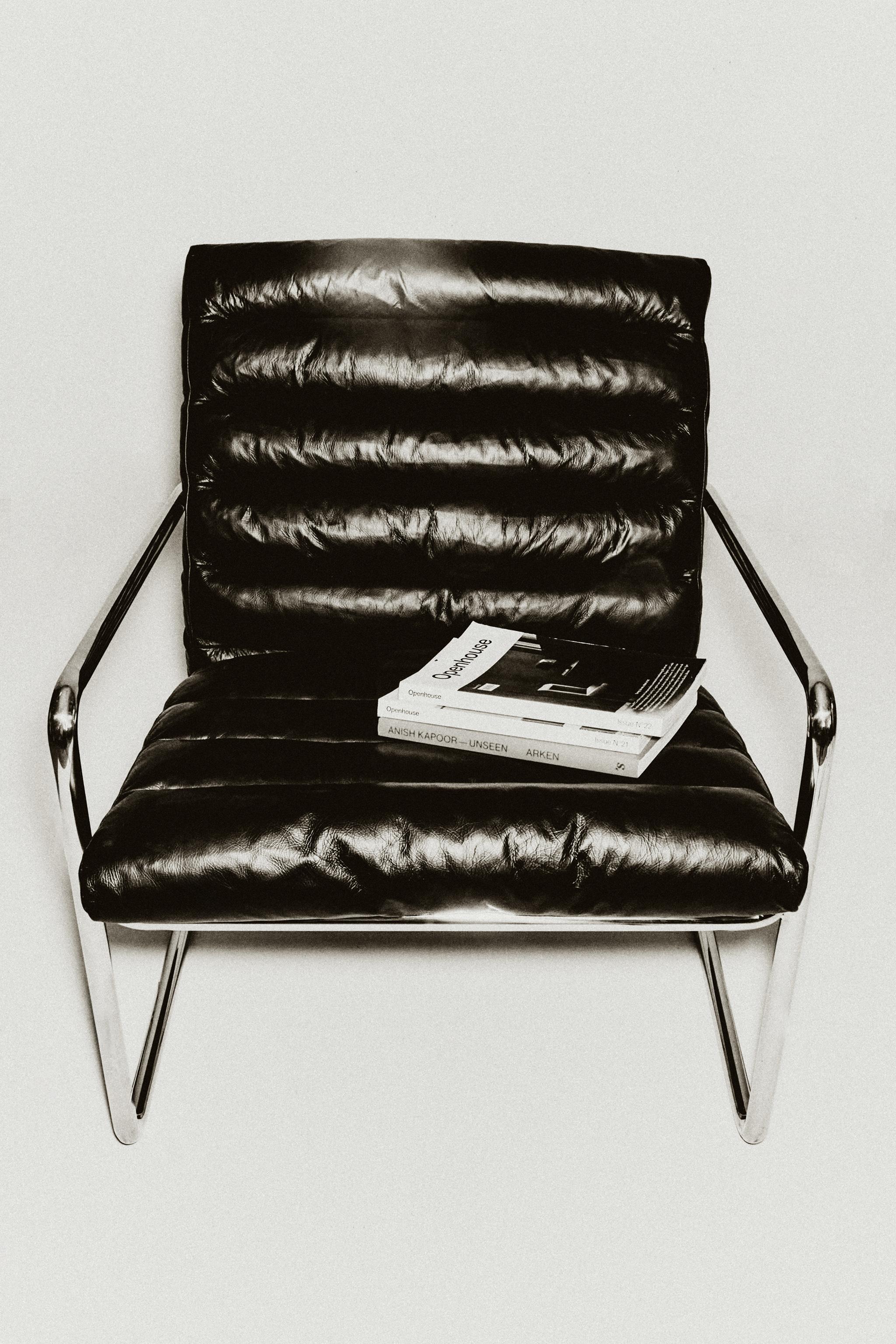 LEATHER AND STAINLESS STEEL ACCENT CHAIR